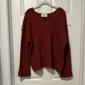 Daytrip V-Neck Distressed Sweater in Rich Red